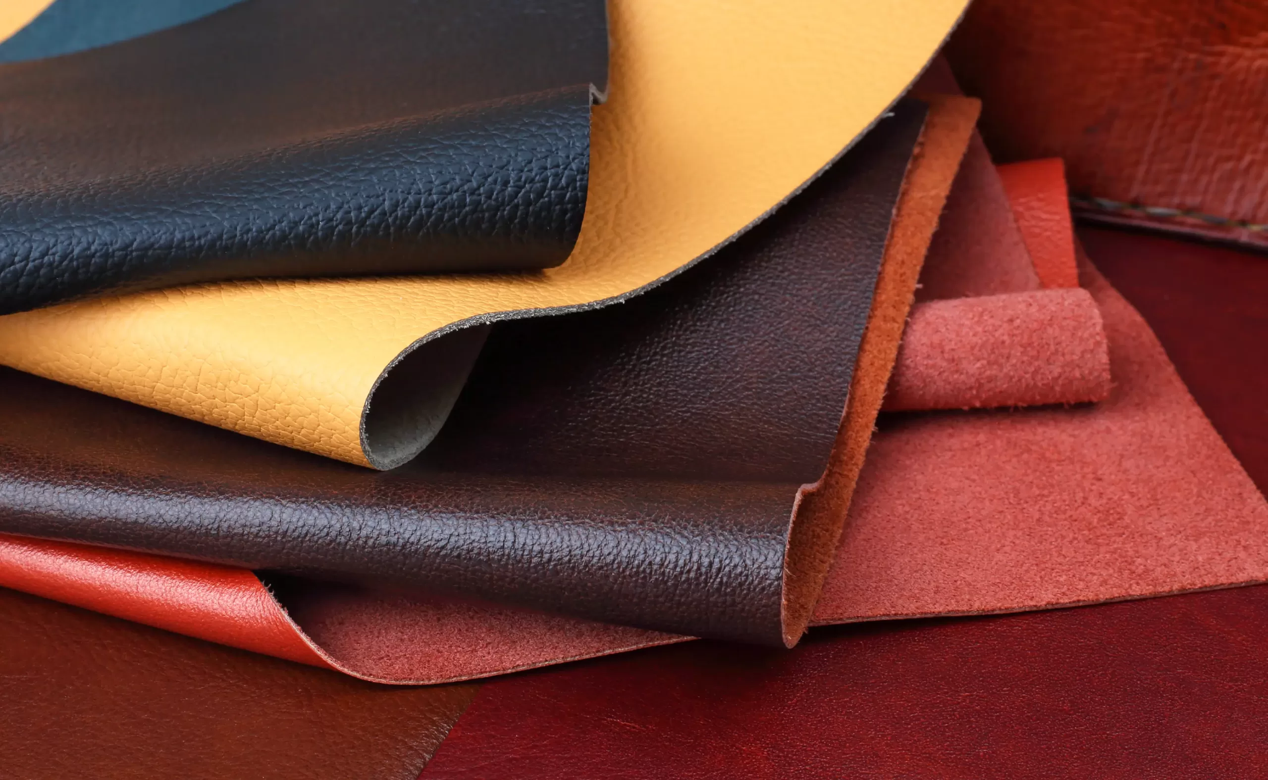 Different types of leather skins, colorful and textured.